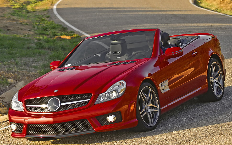 red Mercedes-Benz convertible coupe on road HD wallpaper