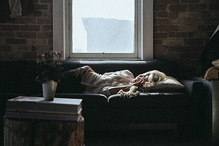 woman sleeping on sofa near window and table HD wallpaper