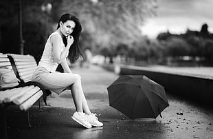 grayscale photography of woman in white tank top and white skirt sitting on white bench HD wallpaper
