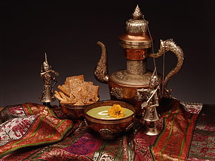 middle eastern tea pot with two round bowls and two soldier figurines on table HD wallpaper