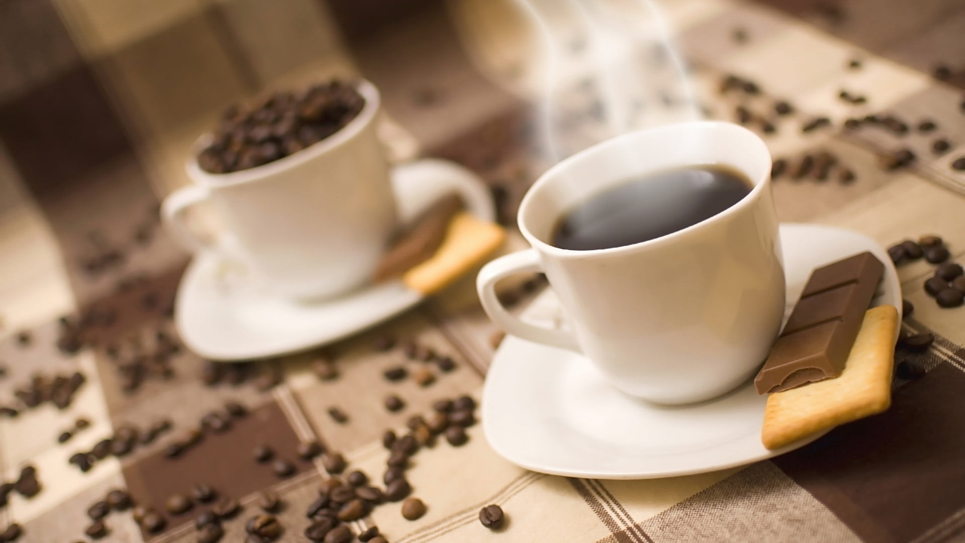 two white ceramic tea pot with black coffee