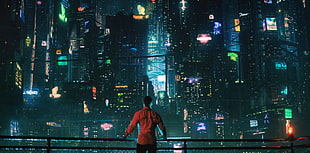 man facing lighted buildings movie still HD wallpaper