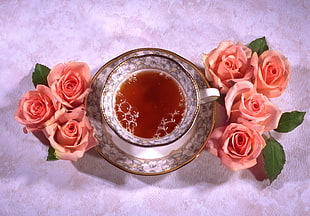 tea in ceramic teacup with saucer near pink Rose flowers acceent HD wallpaper