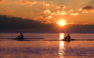 two person on boat at sunset HD wallpaper