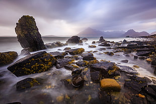 black stone under blue cloudy sky, elgol