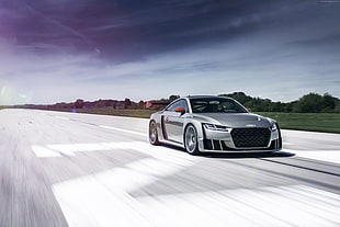 timelapse photography of silver Audi coupe along highway