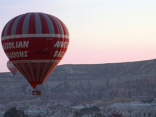 red and gray Hot Air Balloon flying on gray mountains during daytime, cappadocia HD wallpaper