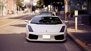 photograph of white Lamborghini sports car parked on roadside at daytime HD wallpaper