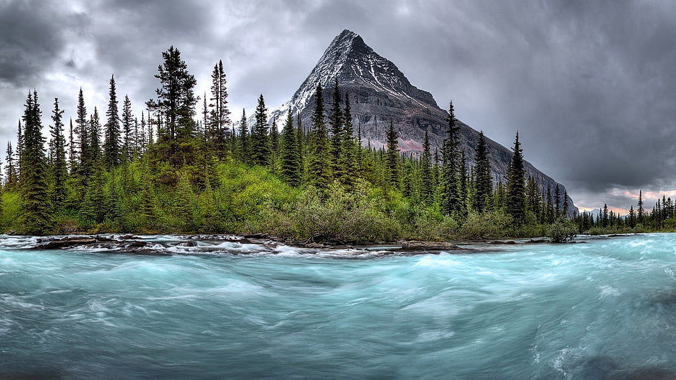 time lapse of water near mountain at daytime HD wallpaper
