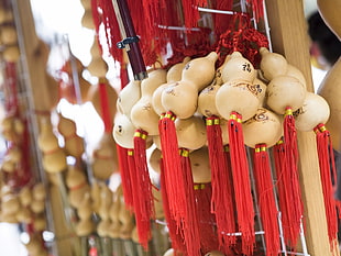 focus photo of white and red hanging decor