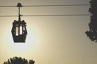 silhouette of person in cable car