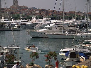 white sailing ship on bodies of water