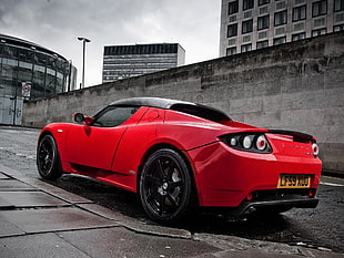 selective color photography of red Tesla Roadster HD wallpaper
