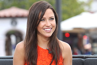 woman in red tank dress smiling