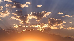 grey clouds with sun light beams