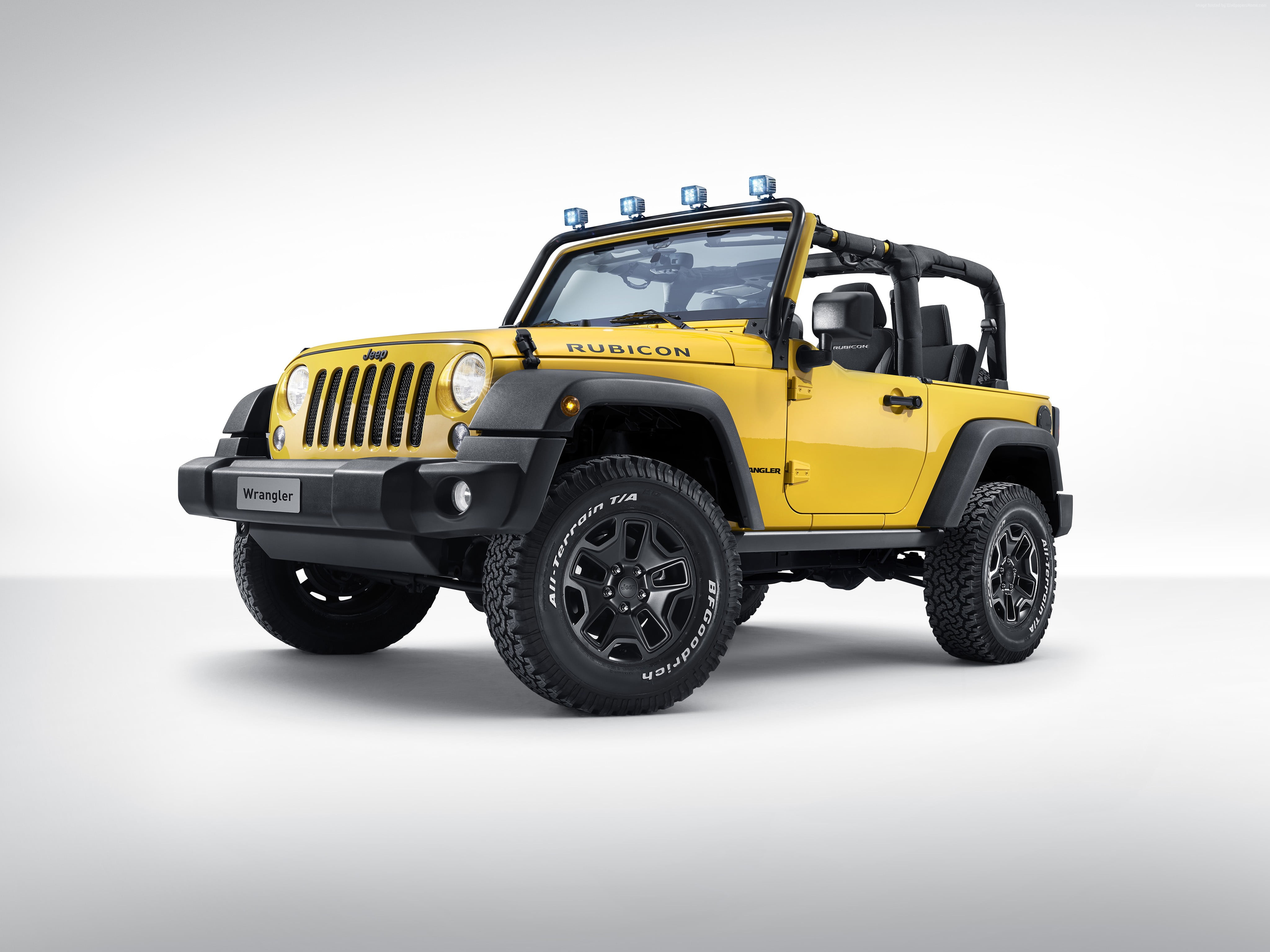 yellow Jeep Wrangler with floodlight