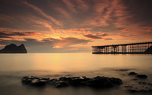 silhouette photography of body of water and bridge HD wallpaper