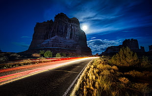gray asphalt road surrounded by brown grass under blue sky during nighttime, night, road, Utah, USA HD wallpaper