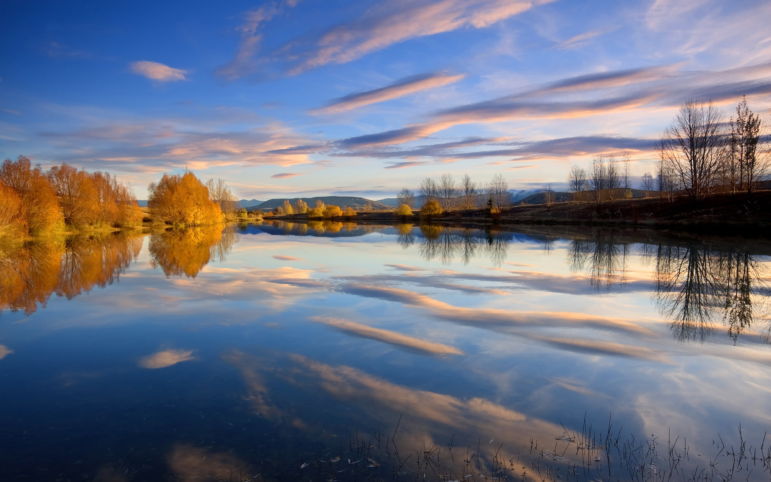 photography of body of water with blue sky as background