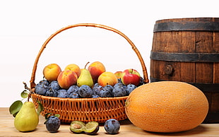 assorted fruits in brown wicker basket HD wallpaper