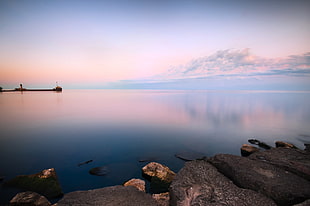 body of water near rocks photo