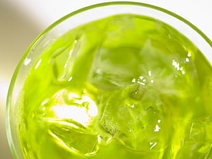 clear drinking glass filled with green liquid substance and ice HD wallpaper