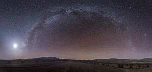 empty road during starry night photo