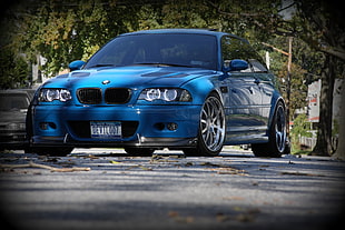 blue BMW car on street near trees HD wallpaper