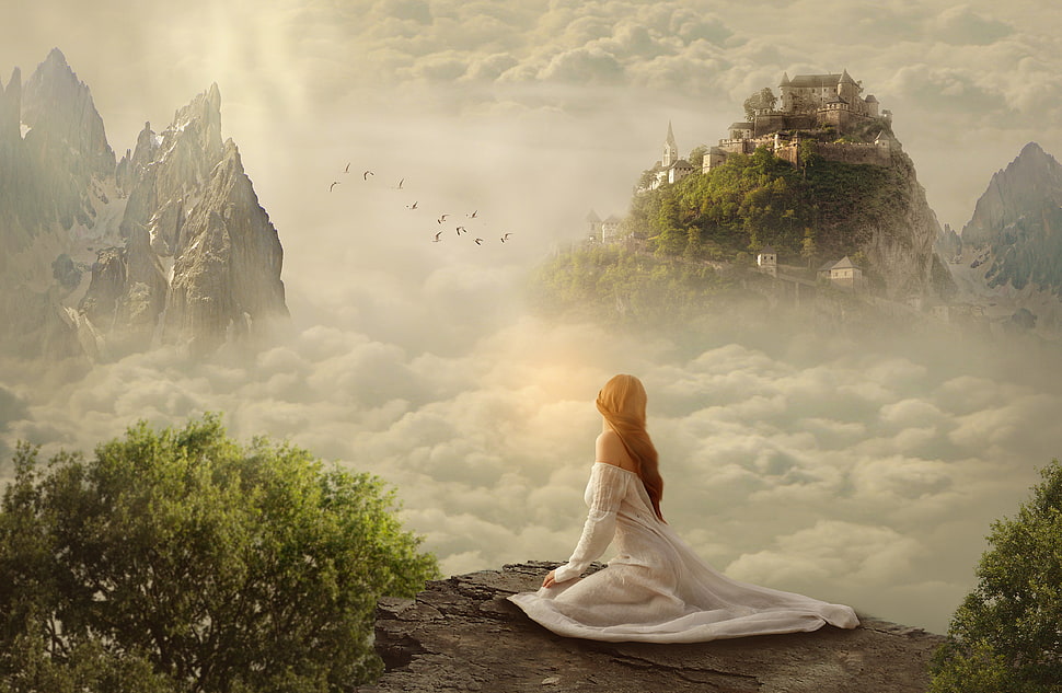 woman wearing white off-shoulder dress sitting on ground watching over palace on stone formation during daytime HD wallpaper