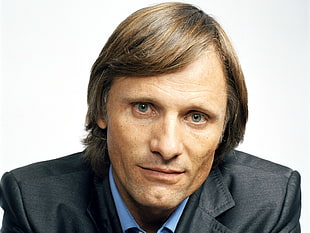 brown haired man in black formal suit