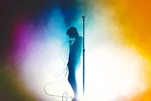 man holding corded microphone wallpaper, concerts, silhouette, Lauren Mayberry, Chvrches HD wallpaper