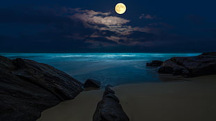 full moon above a blue sea at night HD wallpaper
