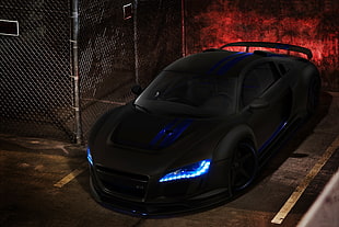 matte black sports coupe parked beside gray cyclone fence HD wallpaper