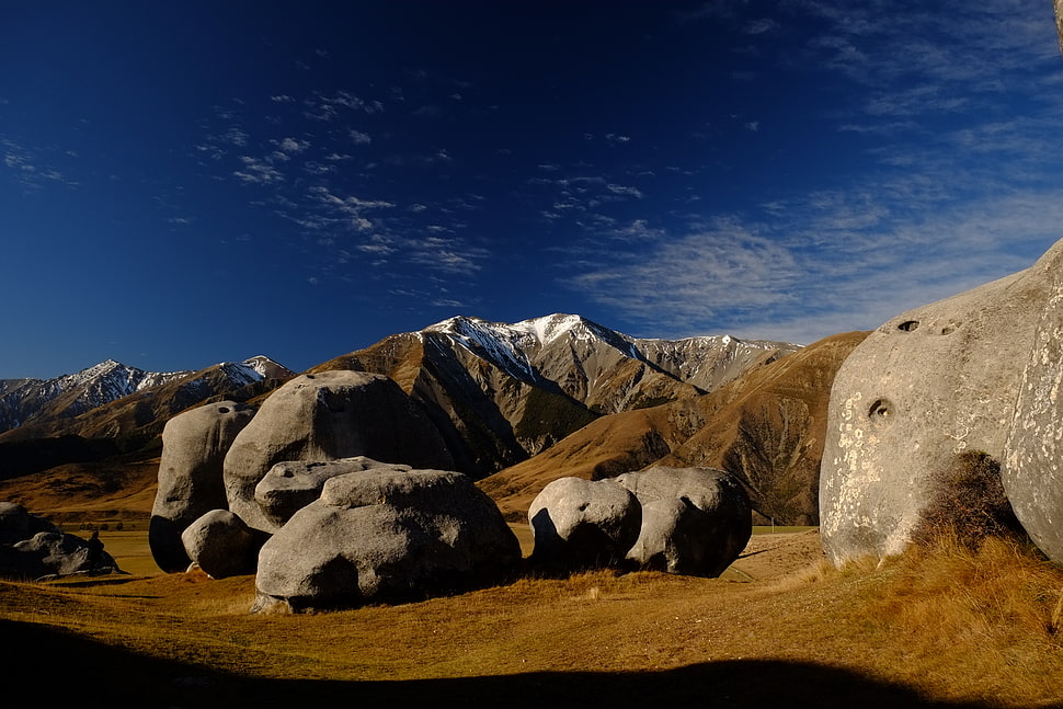 rock formation on brown field during daytime HD wallpaper