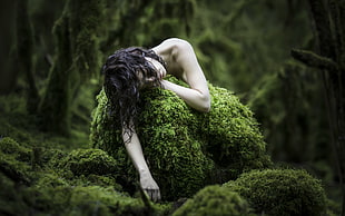 topless woman lying on rock covered by algae during daytime HD wallpaper