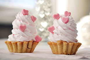 two cupcakes on white surface HD wallpaper