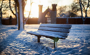brown wooden bench covered in snow during daytime HD wallpaper