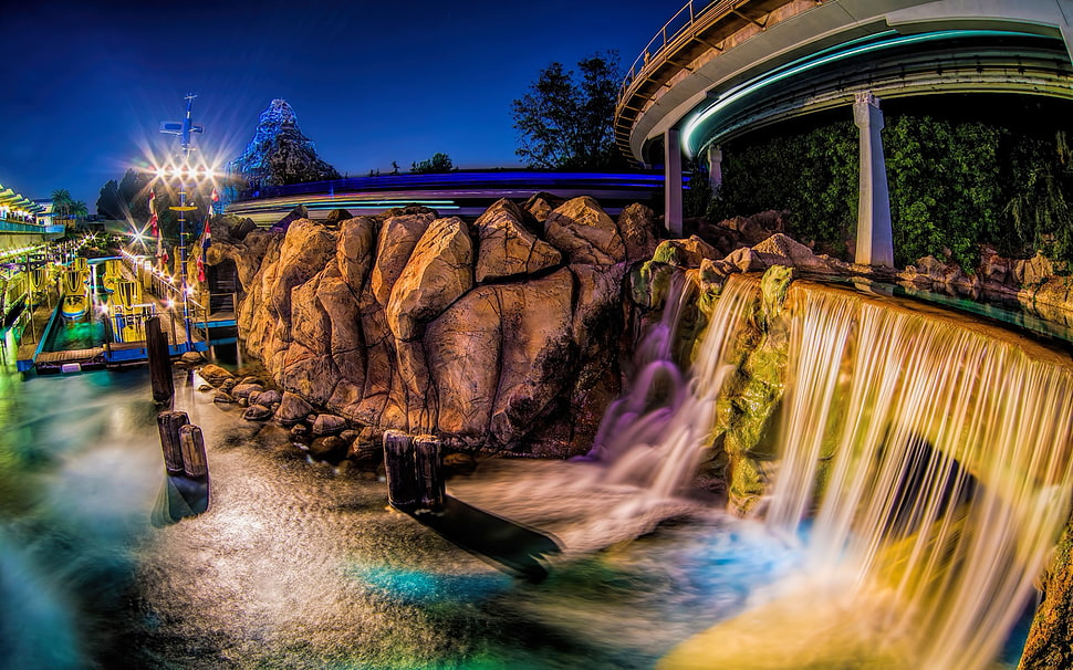 brown and black wooden table, Tomorrowland, waterfall HD wallpaper