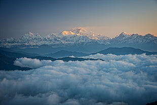 snow covered mountain covered in fogs, landscape, clouds, mountains, snowy peak HD wallpaper