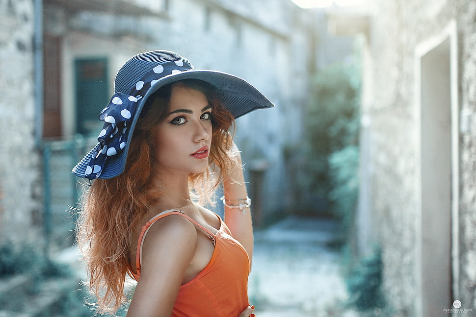 woman wearing gray sunny hat and orange sleeveless blouse HD wallpaper