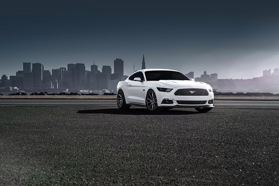 white Ford Mustang coupe on black pavement HD wallpaper