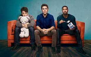 three mens sitting on red sofa HD wallpaper
