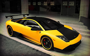 black and yellow Lamborghini Huracan parked on roadside HD wallpaper