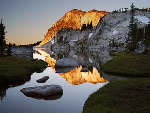 gray rock formation near body of water