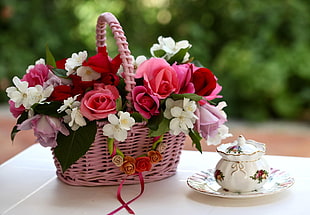 shallow focus photography of flowers in pink basket on table HD wallpaper