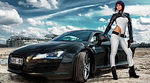 black haired woman wearing black and white long-sleeved shirt and pants holding car's side mirror during daytime