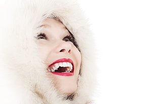 woman wearing white hooded furry coat