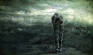 gray scale photo of a man walking on ruined village digital wallpaper