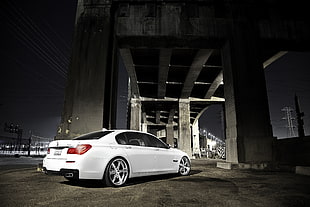 white sedan parked under bridge during night time HD wallpaper