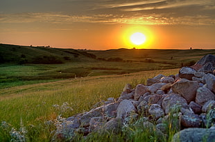 sunset scenery at the farm with stack of gray rocks HD wallpaper